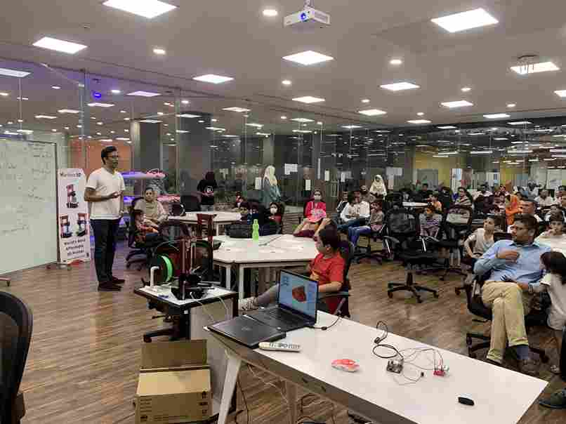 In a classroom full of parents and students attending the STEM open house session. 
      Instructors giving a presentation on the STEM Education and the learning pathways