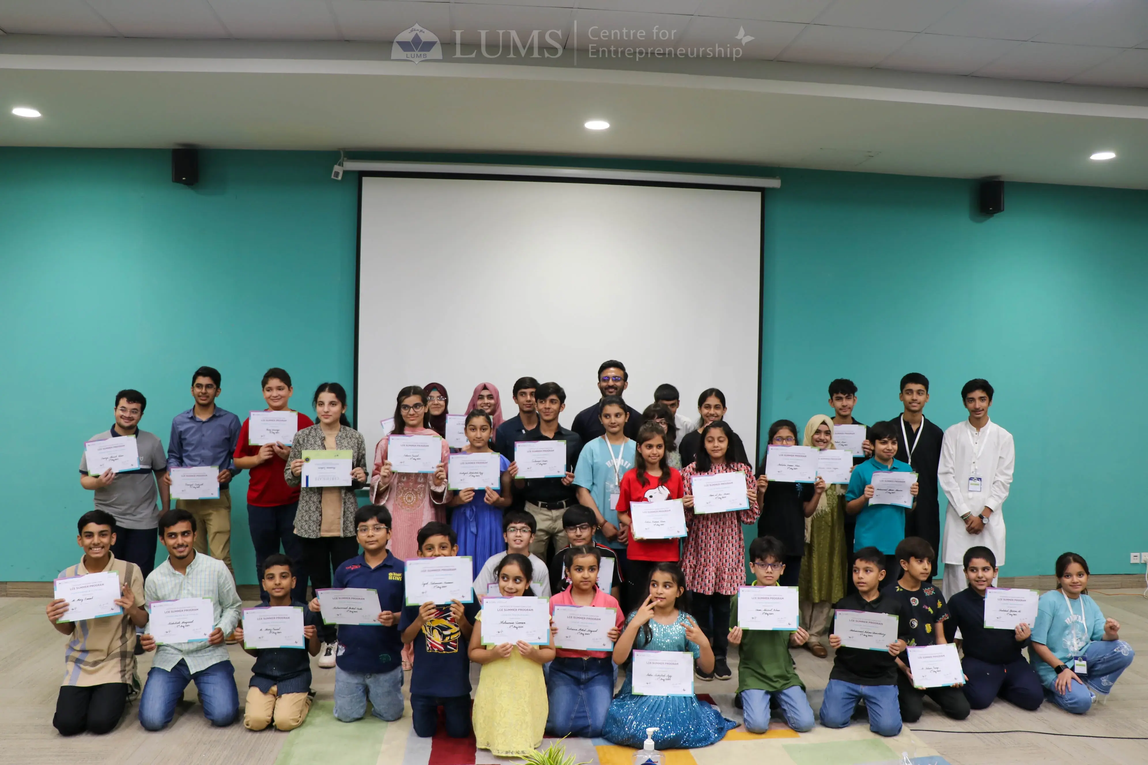 Summer program students with certificates